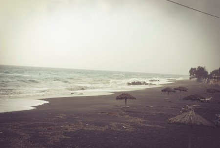 Santorini Perissa beach in winter time. Mist.