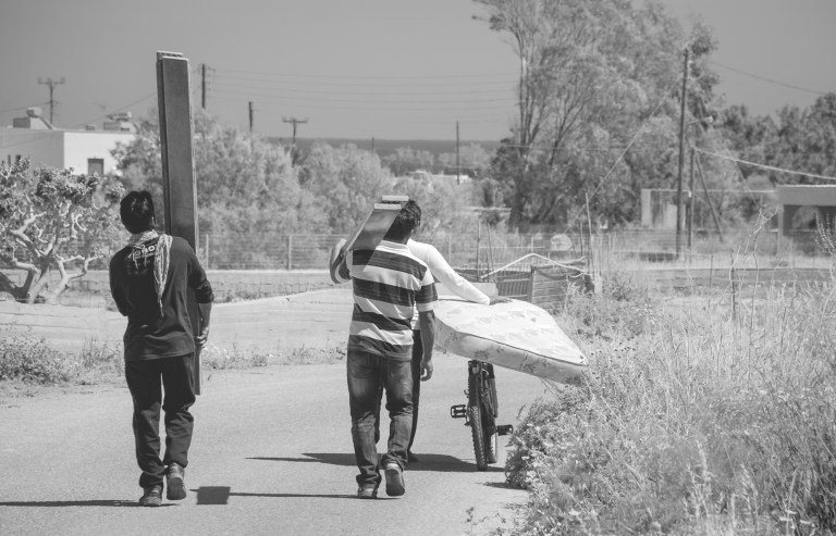 Santorini locals moving mattress using only bike 