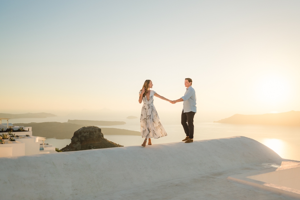 Santorini photographer. Photoshoot in Greece. Sunset photo session with a caldera view and white washed village view.