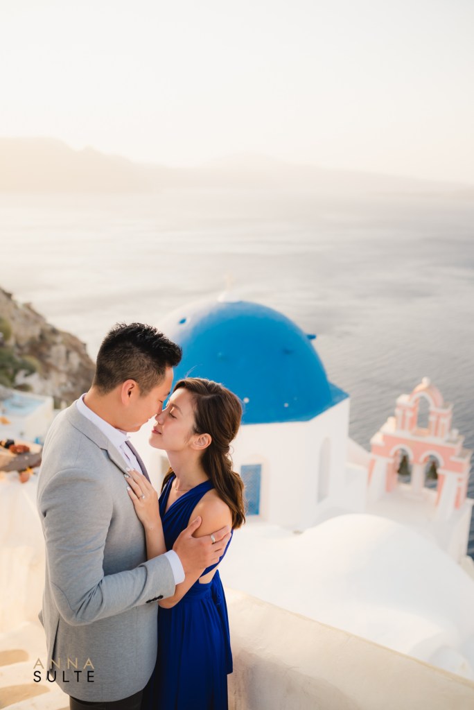 Santorini honeymoon photo shoot by the blue churches in Oia