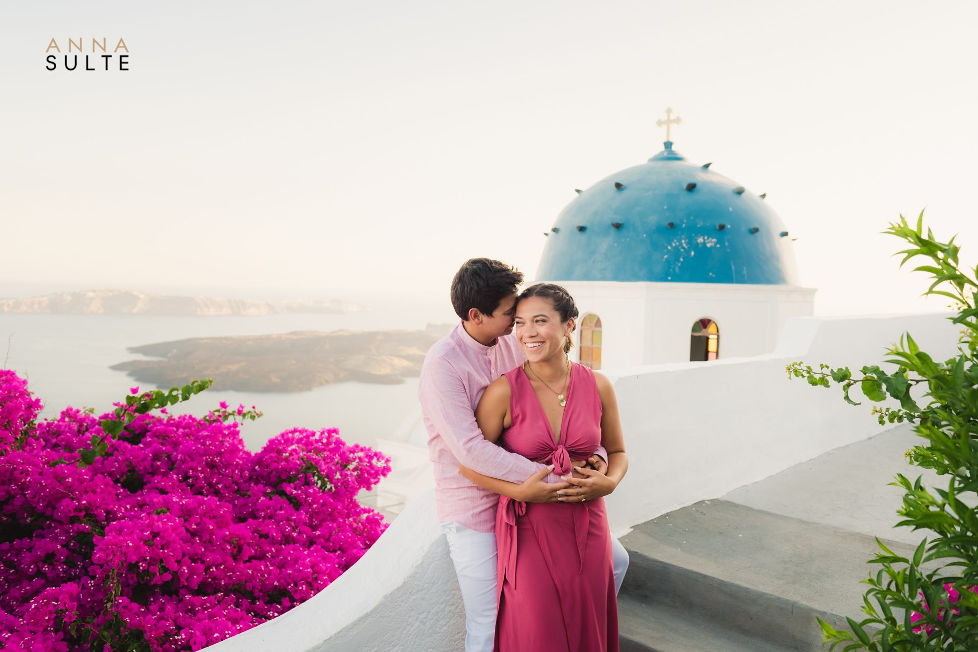 Couples engagement photoshoot at the blue churches in Santorini Greece