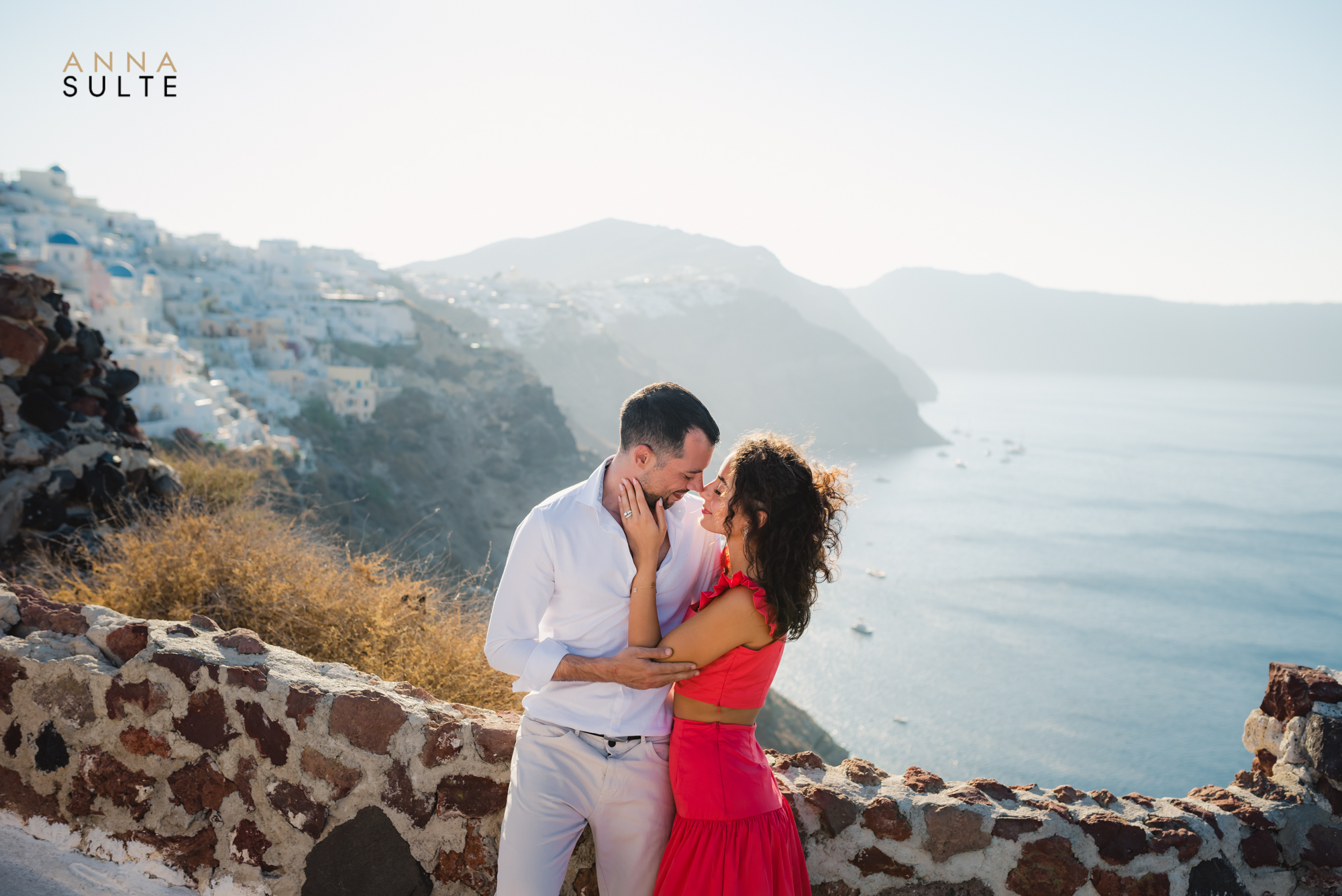 Oia caldera views Santorini. Photoshoot of a couple.