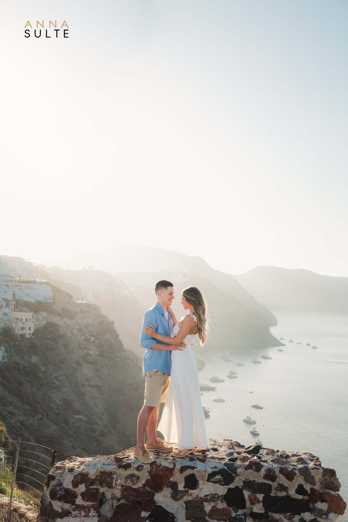 Santorini epic Caldera view. Santorini cliffs and a photo shoot of a couple just engaged. 