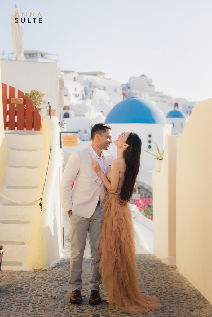 Couple laughing on the street in Oia village