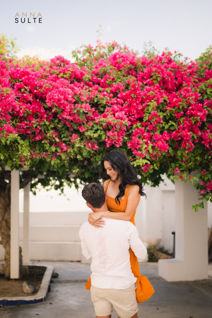 Dancing couple in Oia village, Greece.