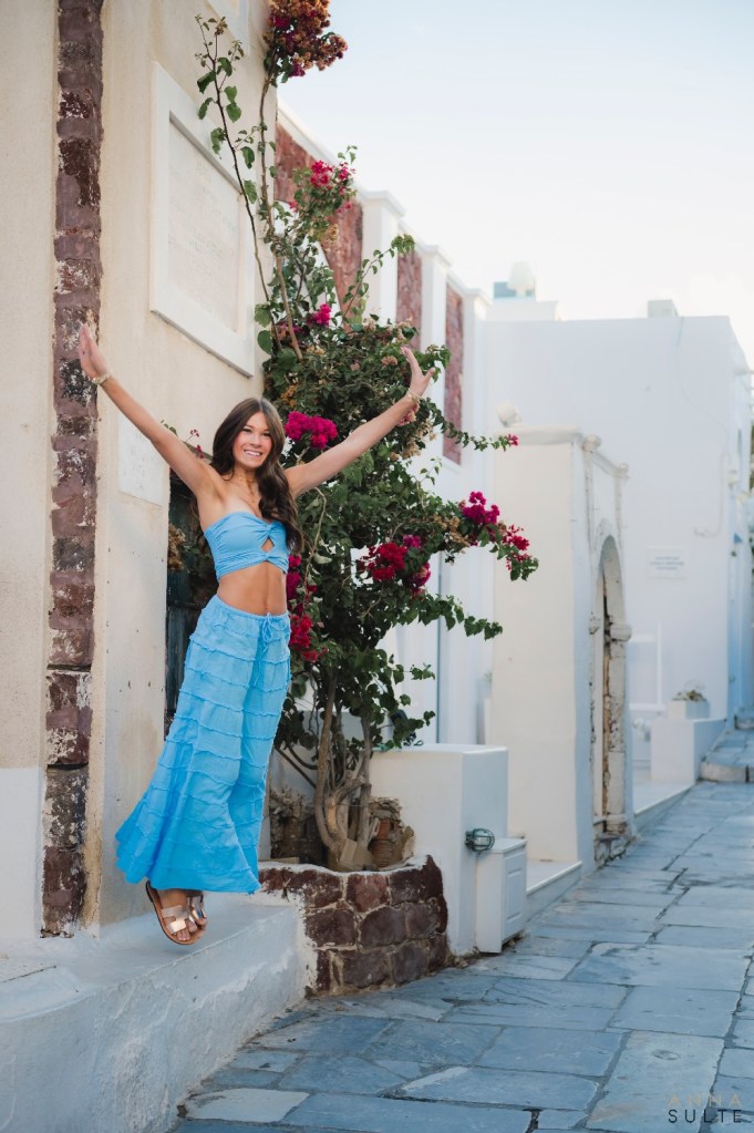 Senior, fun jumping shot in Santorini