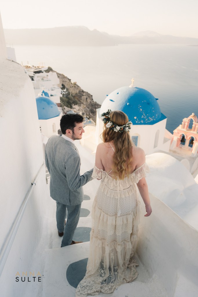 Santorini blue domes engagement photos in Oia Greece
